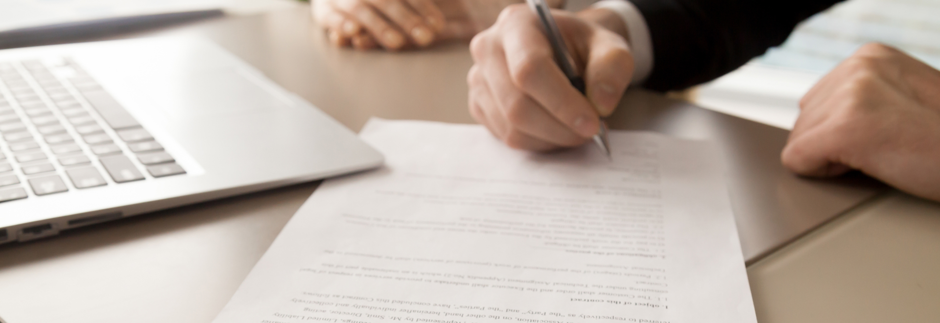 people signing a contract