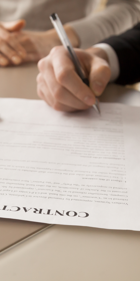 people signing a contract