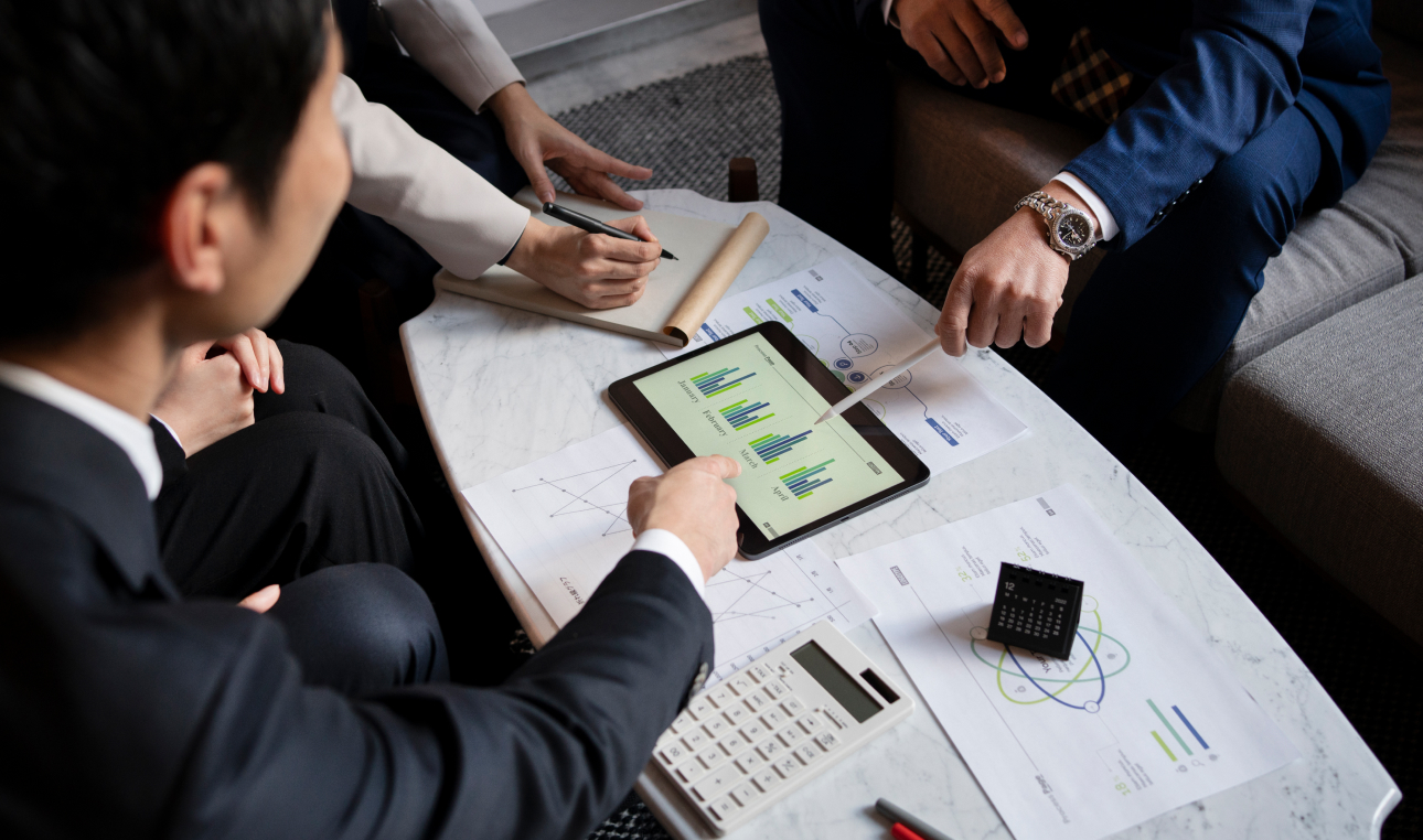 office workers dicussing with ipad