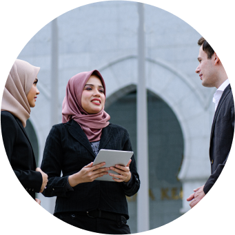 people discussing while standing outdoors